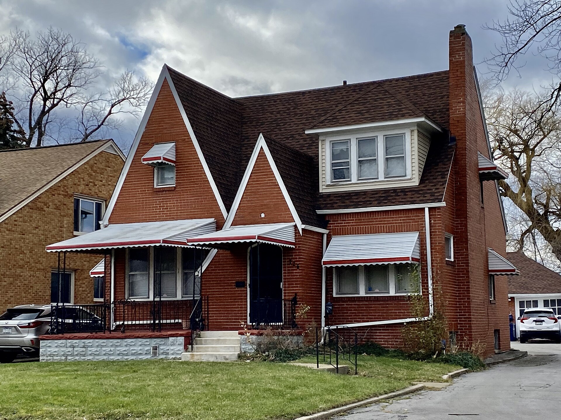 Completed residential roof on a brick home