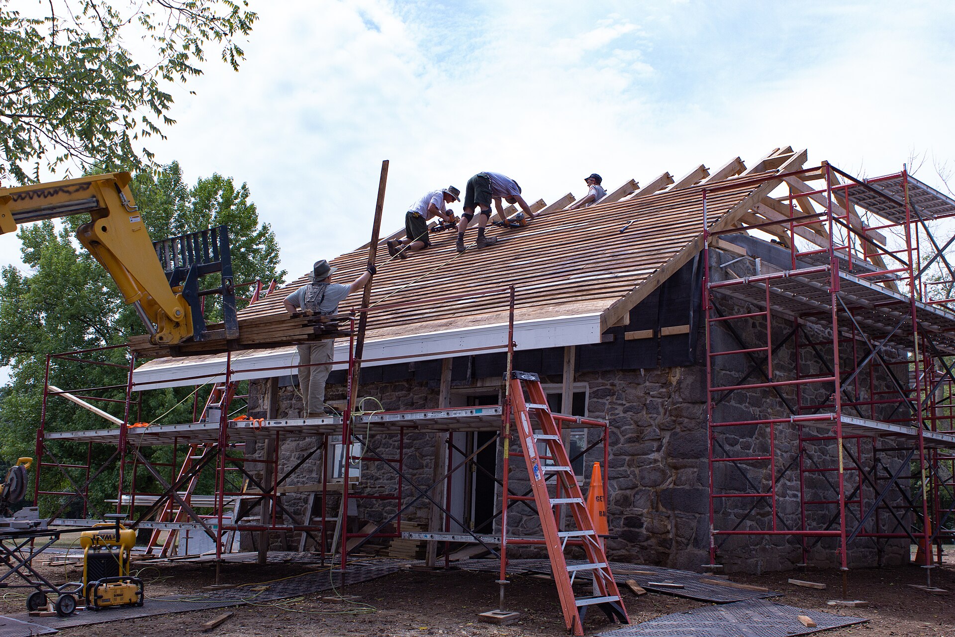 Crew installing a new roof deck